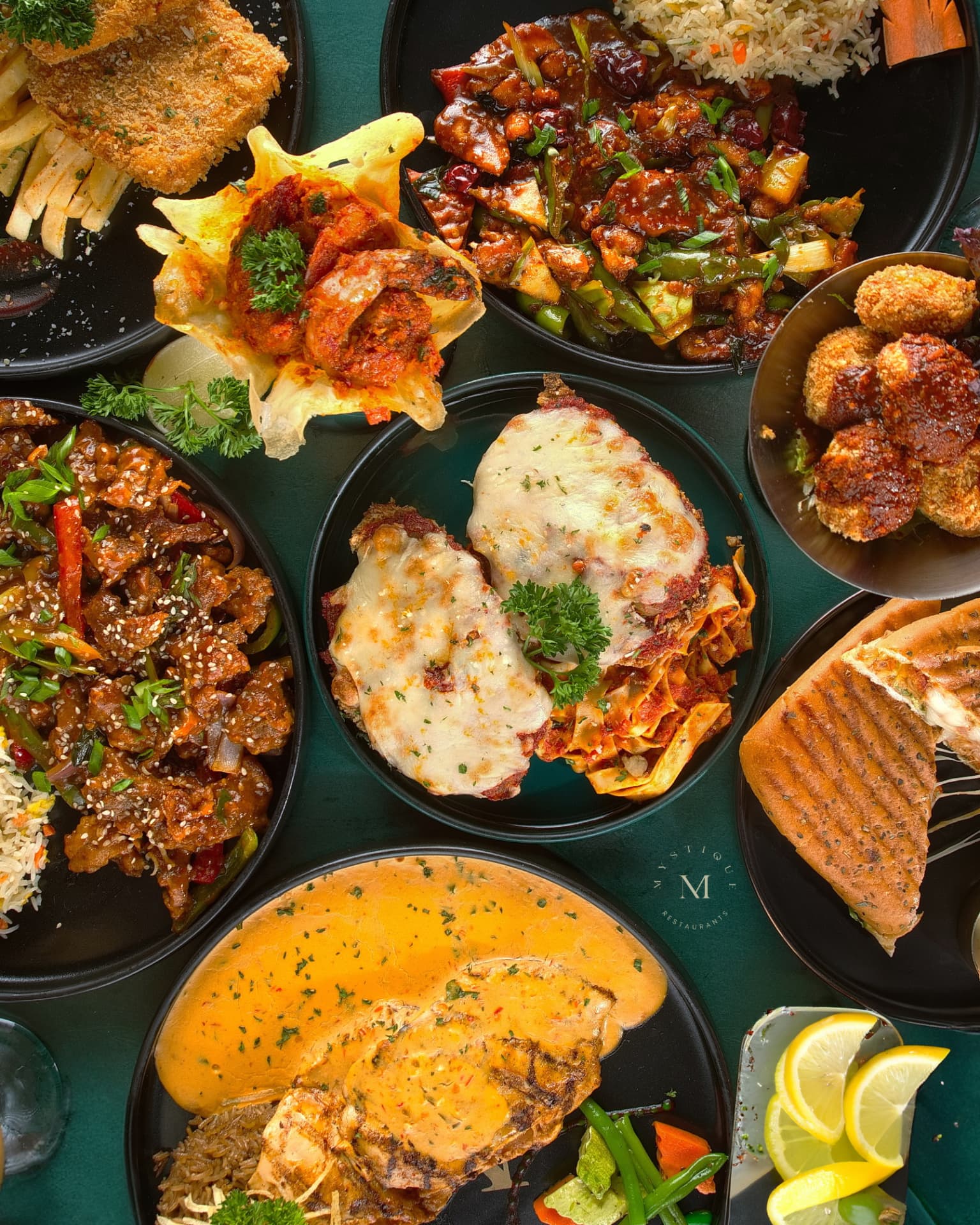 An overhead view of dishes served at Mystique