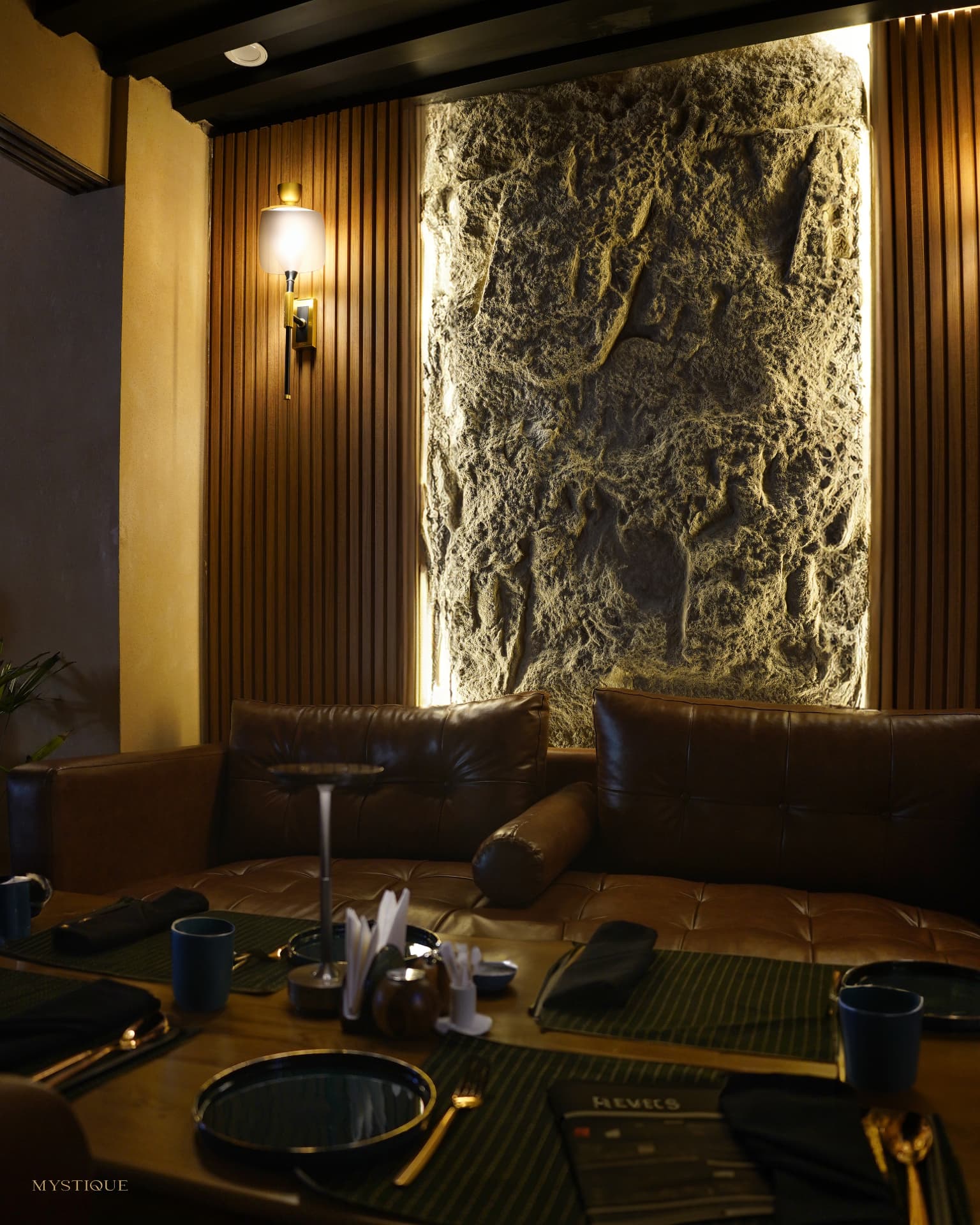 Leather seating and sculptural stone feature wall