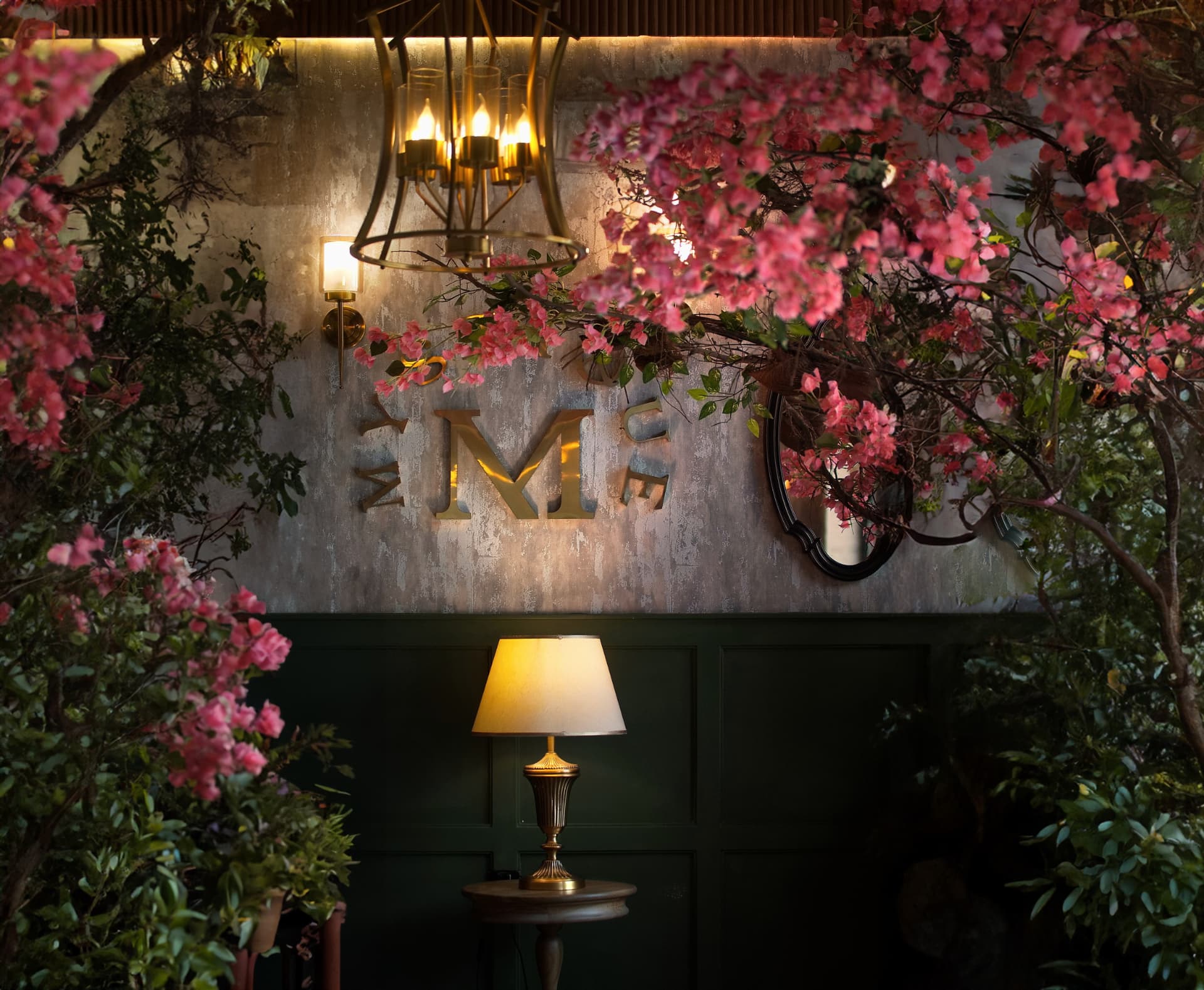 Pink blossoms framing a softly lit dining room